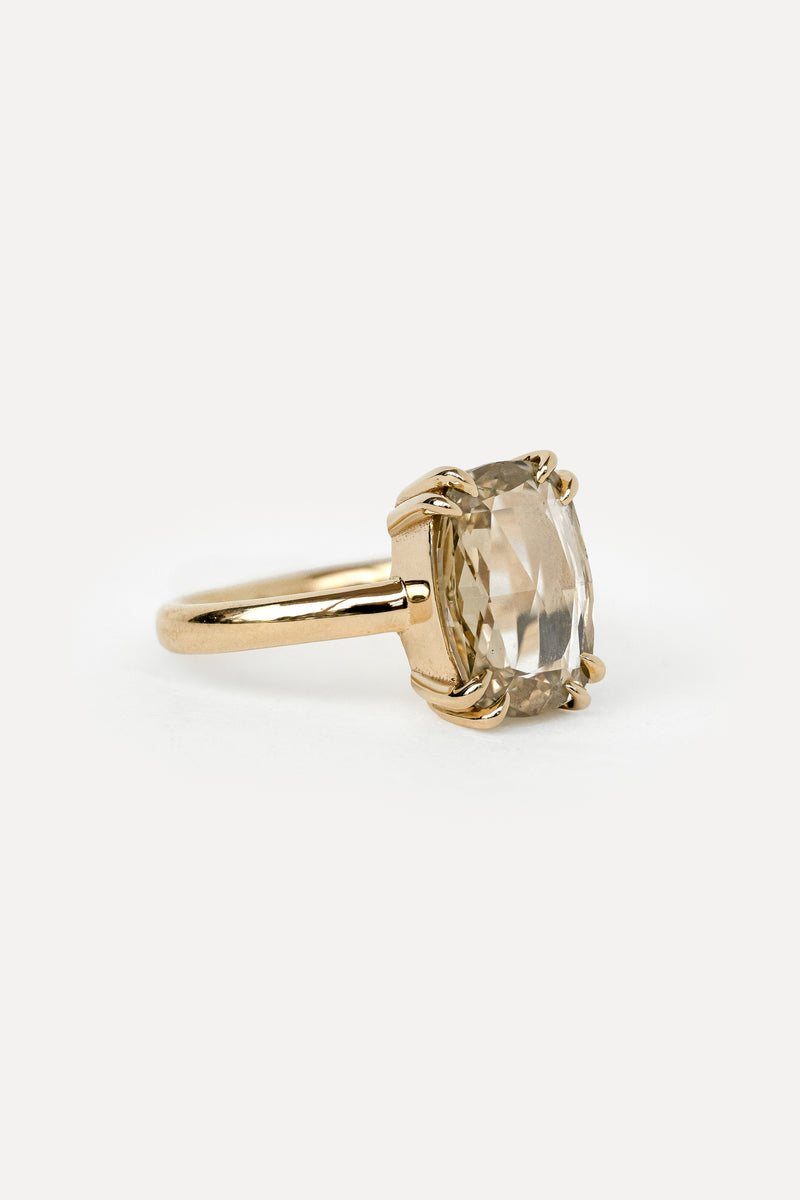 Side view of a solitaire engagement ring in yellow gold with a cushion rosecut diamond 