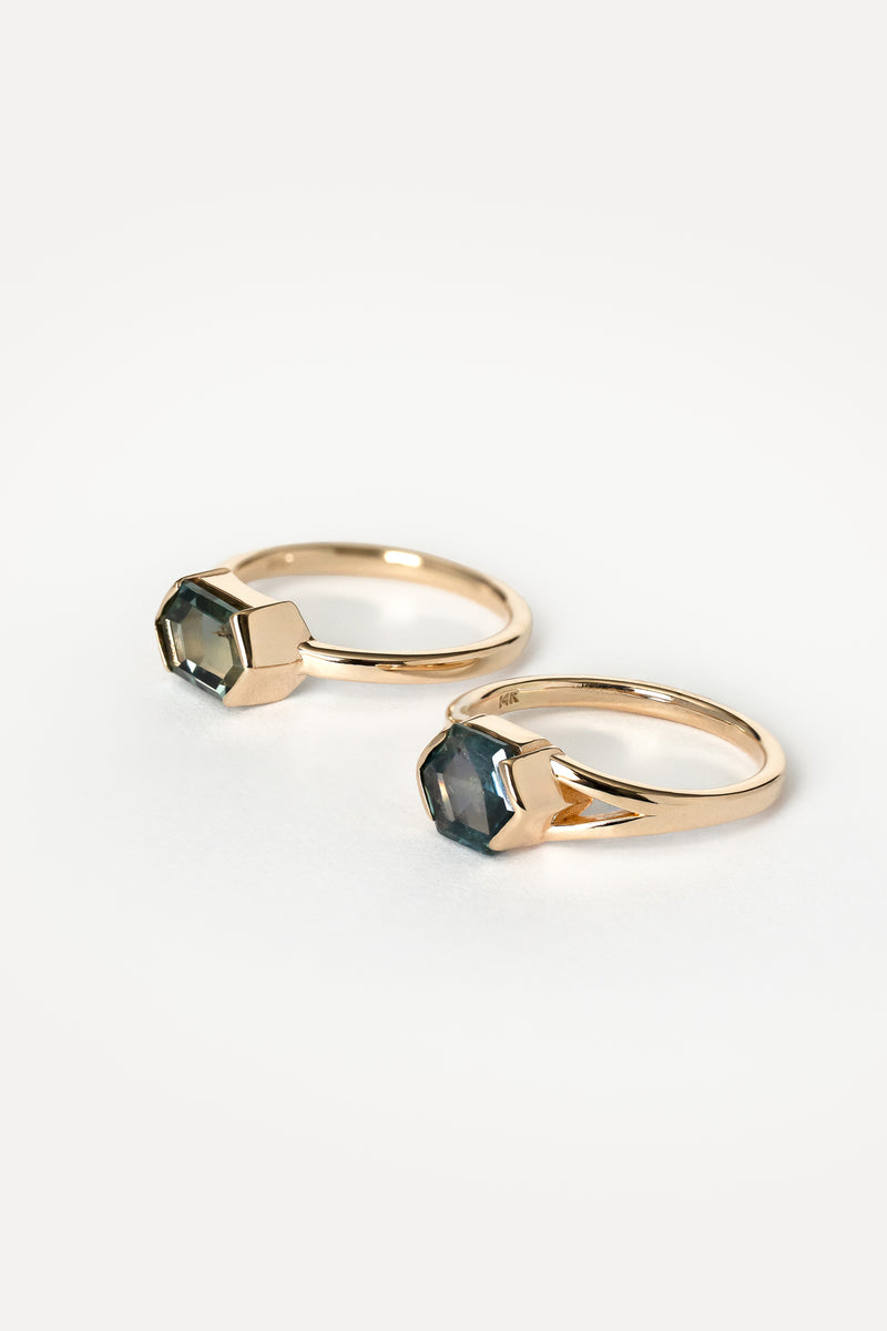 Two rings matching ring with blue hexagon Montana sapphires on a white background